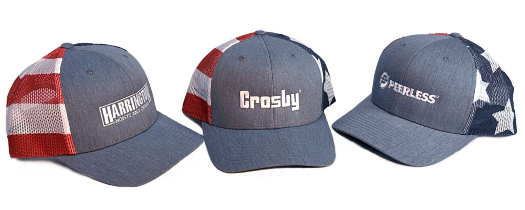 Three embroidered blue trucker hats featuring patriotic designs and company logos.
