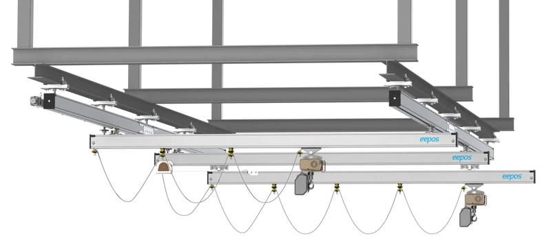 Overhead crane system with adjustable tracks and chains for industrial lifting solutions.