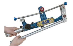Hands operating a blue and silver tube bender tool for precise metal shaping and bending tasks.