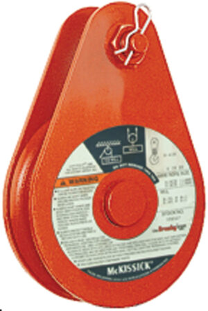 Orange industrial pulley block with labeling details, used for heavy lifting and mechanical applications.