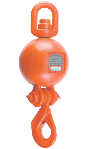 Orange crane hook block with safety label, used for heavy lifting in industrial applications.