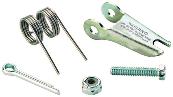 Various metal hardware components, including springs, cotter pin, bolt, nut, and a clamp with warning text, isolated.